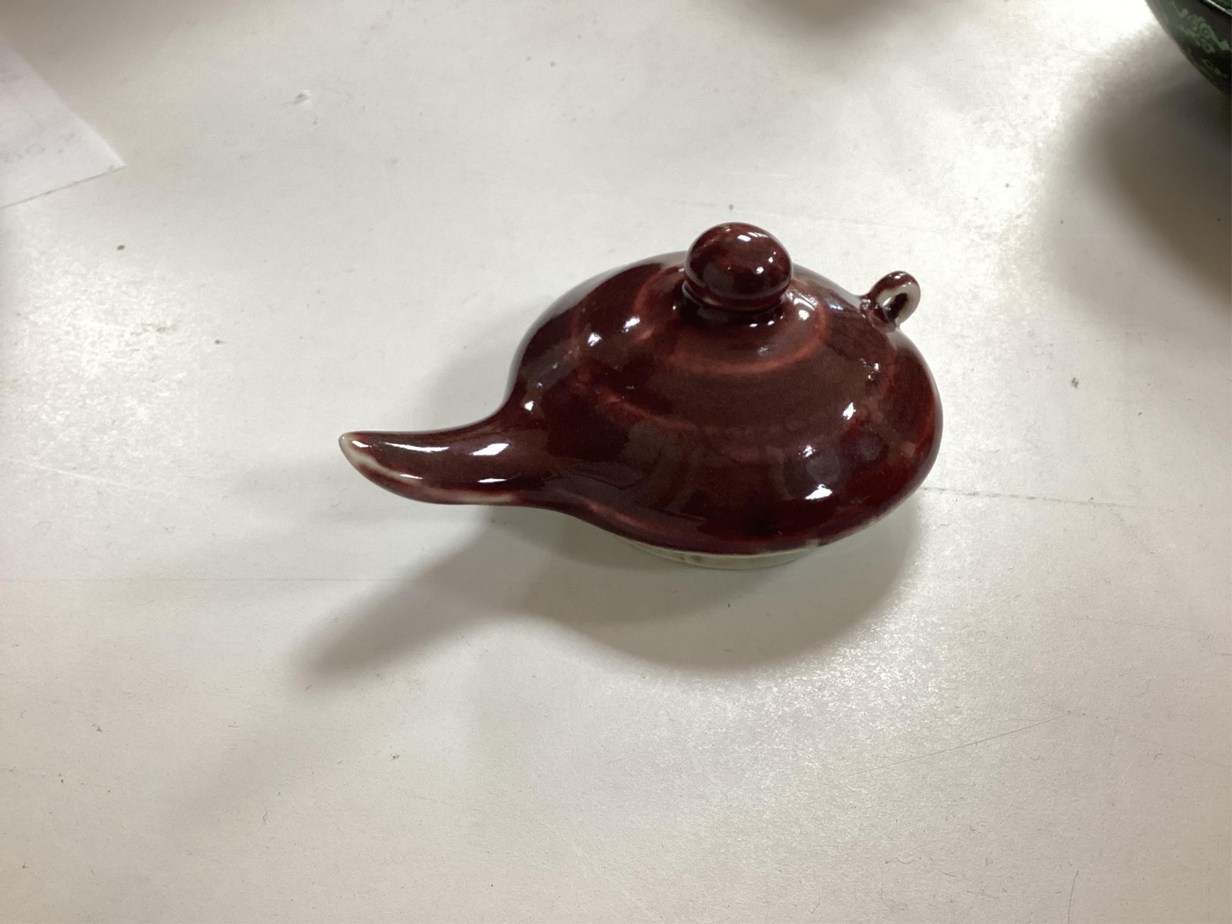 A Chinese famille noire ‘dragon’ dish, 22.5cm diameter, and a Sang de boeuf glaze monk’s cap ewer, Condition - good